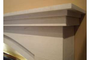 Dovetail Arch Limestone fireplace with lights