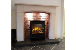 Sissari limestone fireplace with brick effect chamber