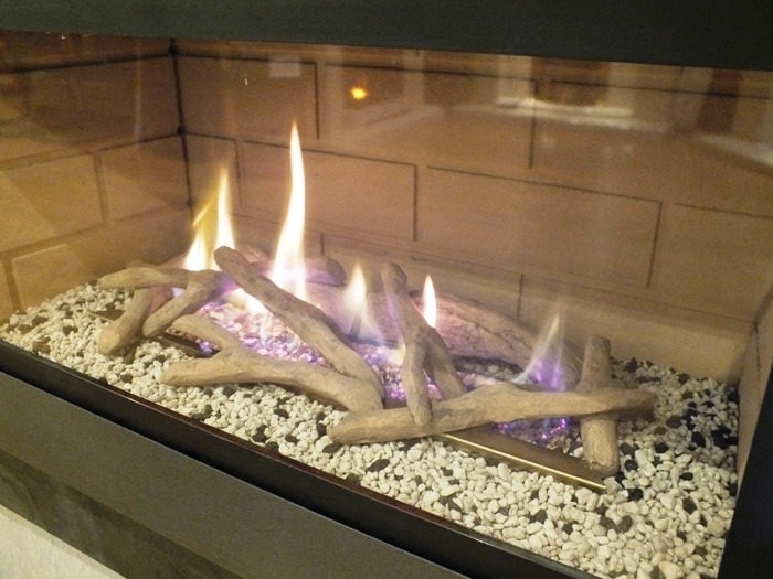 LogFlame hole in the wall