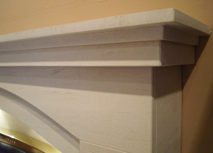 Dovetail Arch Limestone fireplace with lights