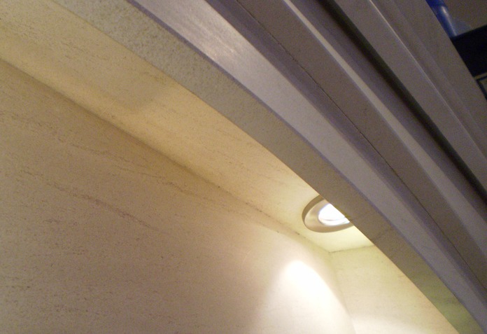 Dovetail Arch Limestone fireplace with lights