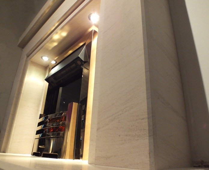 Salus limestone fireplace with lights