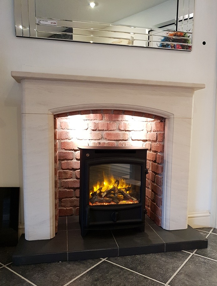 Sissari limestone fireplace with brick effect chamber