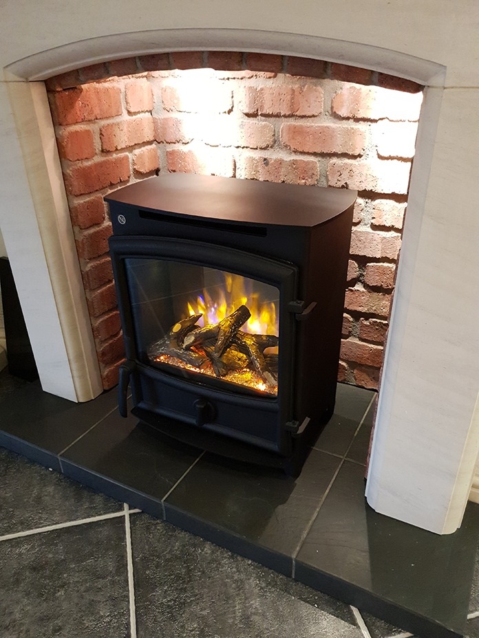 Sissari limestone fireplace with brick effect chamber